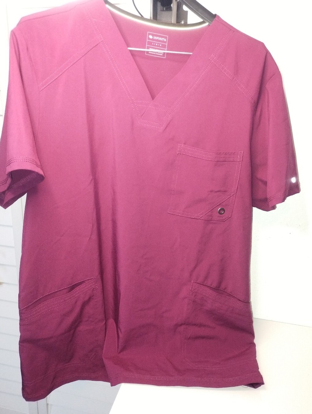 a Cherokee Infinity Men's 3-Pocket V-Neck Scrub Top in the color Wine. Size L